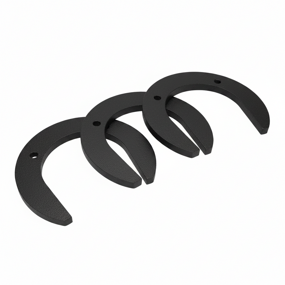 Three black horseshoes on a light blue background